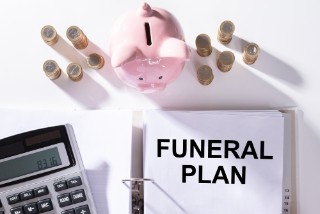 Funeral Plan Papers, Stack Of Coins And Calculator