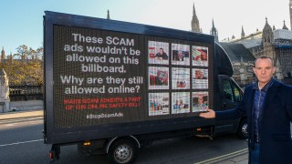 Martin Lewis outside Parliament with an advertising van - its display pictures examples of scam ads and says: "These scam ads wouldn't be allowed on this billboard - why are they still allowed online?"