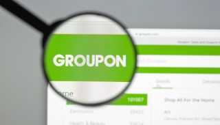 Milan, Italy - August 10, 2017: Groupon website homepage. It. is an American worldwide e-commerce marketplace connecting subscribers with local merchants by offering activities Groupon logo visible.