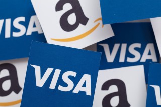 LONDON, UK - November 2021: Amazon and Visa logos. Amazon plans to stop accepting Uk issued Visa payments