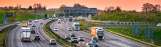 Cars, vans and lorries driving on a busy motorway