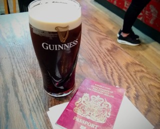 Pint of Guinness and UK passport Pint of Guinness and UK passport.