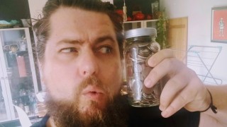 The MoneySavingIdiot holding a jar of coins.
