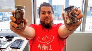 The MoneySavingIdiot holding up a jar of coins in each hand The MoneySavingIdiot holding up a jar of coins in each hand.