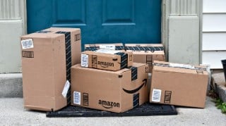 MARYLAND, USA - FEBRUARY 04, 2016: Image of Amazon packages delivered to a home. Amazon is the largest internet based retailer in the United States.