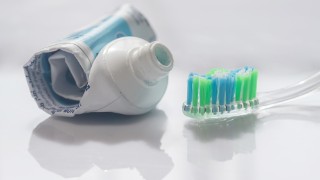 The empty tube toothpaste on white background