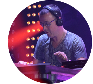 Judge Jules playing a live DJ set Close up of Judge Jules looks at the decks while playing a live DJ set.