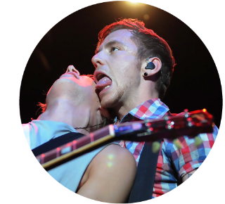 Danny Jones of McFly playing live Danny Jones of McFly sticking his tongue out while playing live.