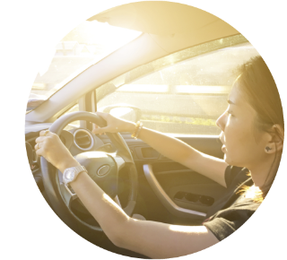 Woman driving a car on a sunny day Woman driving a car on a sunny day.