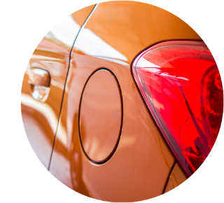 Close up of the fuel cap on an orange car Close up of the fuel cap on an orange car.