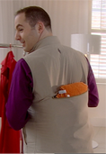 Photo of Martin Lewis wearing a US survivalist jacket, taken from behind him.