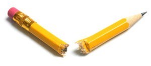 Yellow pencil with a rubber on top that's been snapped in half.