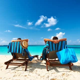 lying on beach on deck chairs