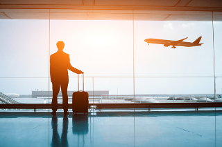 guy watching plane take off