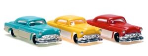 A blue, yellow and red toy car in a row, placed diagonally facing right.