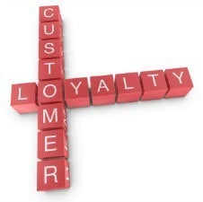 Wooden cubes spelling out 'customer loyalty'.