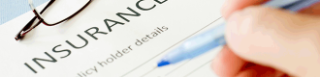 Close up of someone filling in an insurance policy holder details form with a pen.