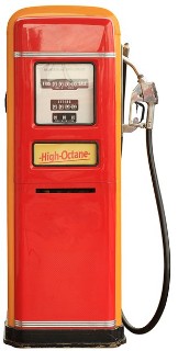 Photo of an old-fashioned red metal fuel pump.