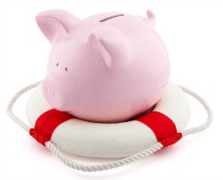 A pink piggy bank sitting in a white and red life ring.