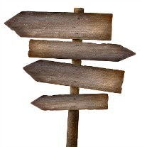 Sign post with three signs pointing left and one pointing right.