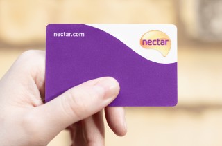 London / UK - October 28th 2020 - Holding Sainsbury's nectar card, customer loyalty points card. 