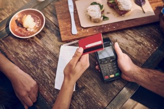 Paying a bill with a card at a restaurant
