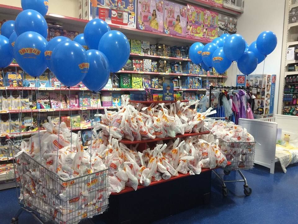 Free goodie bags piled up at a previous Smyths Toys event.