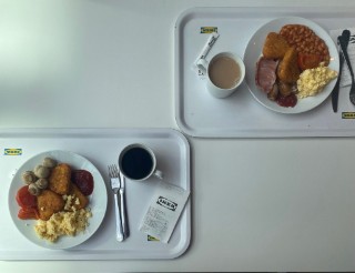 Image of two Ikea breakfast options on a tray with a tea and coffee