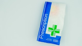 02/15/2020 Portsmouth, Hampshire, UK A British NHS prescription paper bag isolated on a white background